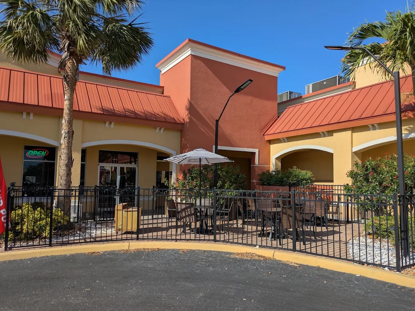 Wicked Pub's storefront and patio in Colonial Center, Fort Myers
